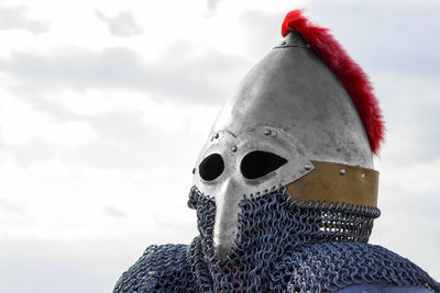 Close-up of armor costume against sky
