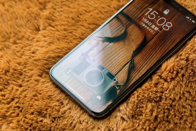 High angle view of smart phone on table