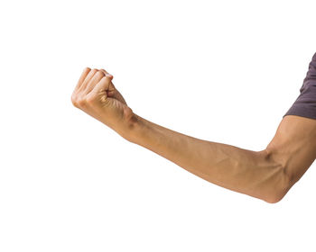 Close-up of hand showing fist against white background