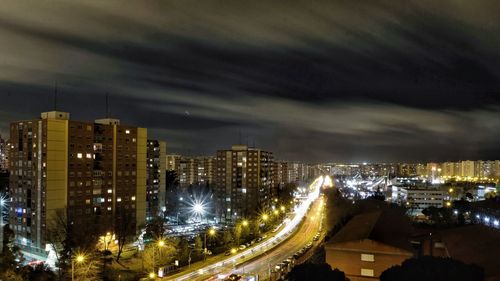 High angle view of illuminated city buildings at night