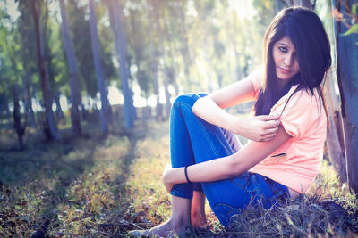 Portrait of young woman in forest