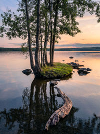 Scenic view of lake against sky during sunset