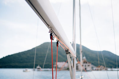 View of sailboat against mountain range