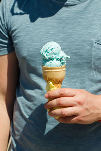 Hand holding ice cream cone