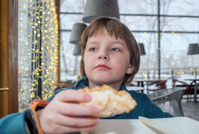 Portrait of boy holding ice cream