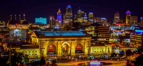 Illuminated city buildings at night