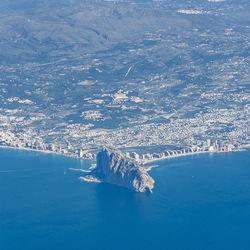 Aerial view of sea and snowcapped mountain