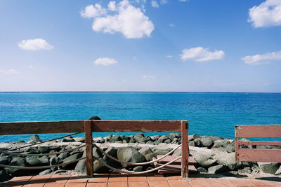 Scenic view of sea against blue sky