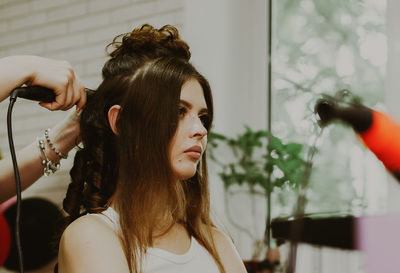 Portrait of a young girl at the hairdresser.