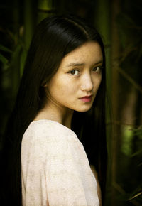 Beautiful chinese teen among bamboo forest v