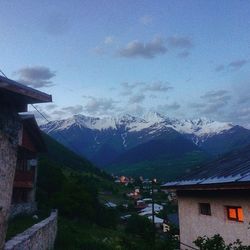 Scenic view of mountains against cloudy sky