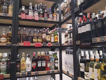 Row of bottles on display at store