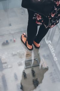 Low section of woman standing on floor