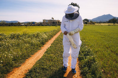 Full length of man standing on field