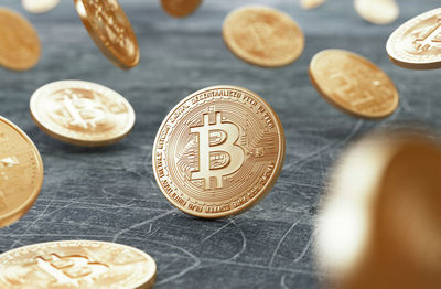 Close-up of bitcoins over table