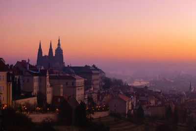 Townscape against sky during sunset