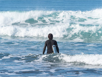 Rear view of man on beach