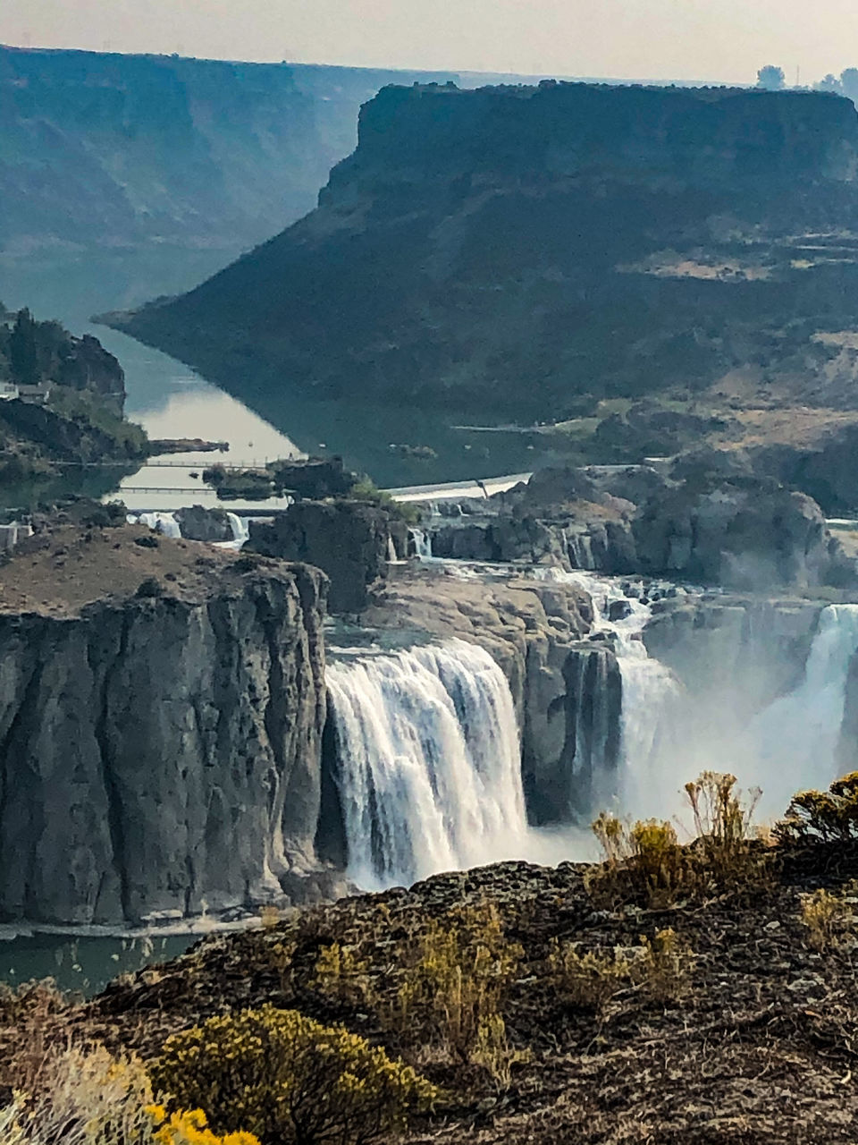 SCENIC VIEW OF WATERFALL IN MOUNTAIN