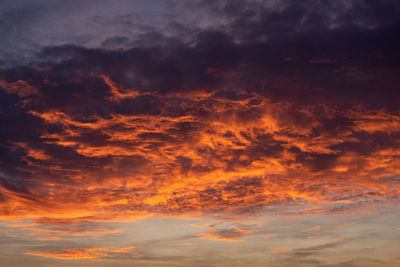 Low angle view of dramatic sky during sunset