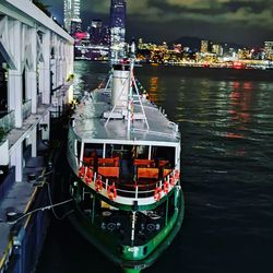 High angle view of boats moored on river in city