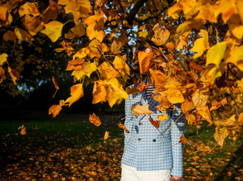 Woman standing in park during autumn