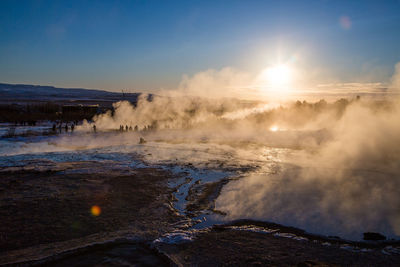 Steam erupting from volcano landscape