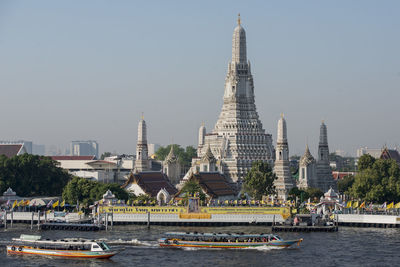 View of buildings in city against clear sky