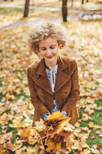 Portrait of young woman in autumn