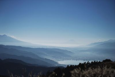 Scenic view of mountains against clear blue sky