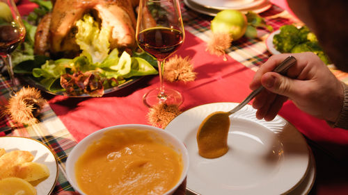 Cropped hand of person preparing food