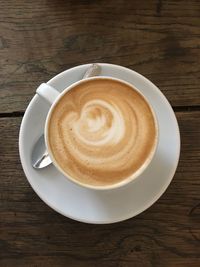 High angle view of cappuccino on table