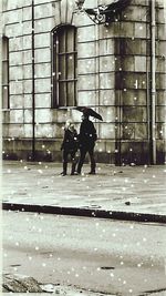 Full length of people in snow