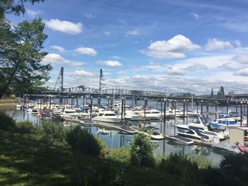 Boats moored at harbor