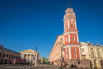 Low angle view of building against clear blue sky