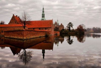 Reflection of buildings in calm lake