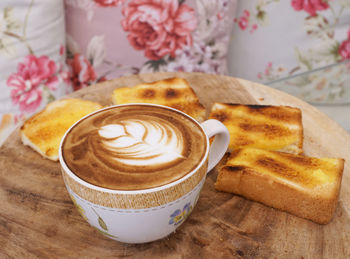 Close-up of coffee cup on table