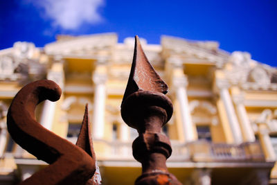 Low angle view of sculpture against building