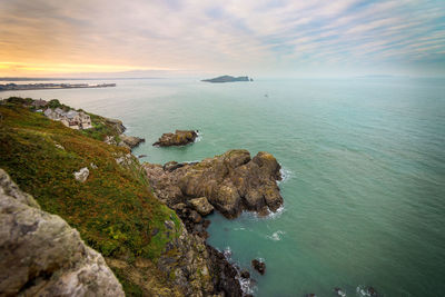 Scenic view of sea against cloudy sky