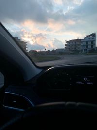 Cars on road seen through car windshield