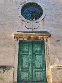 Low angle view of closed door of building