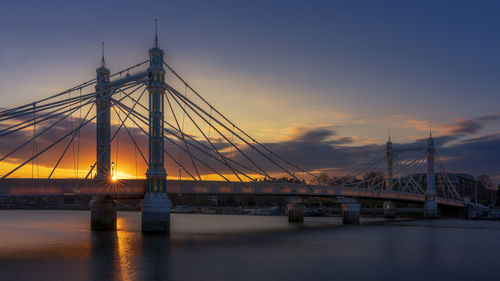 View of suspension bridge at sunset