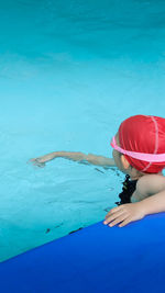 High angle view girl swimming in pool