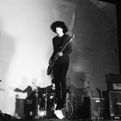 Full length of man playing guitar