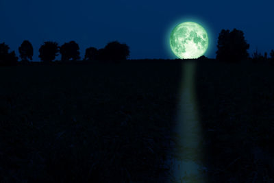Scenic view of field against sky at night