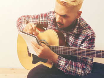 Young man playing guitar