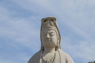 Low angle view of statue against sky