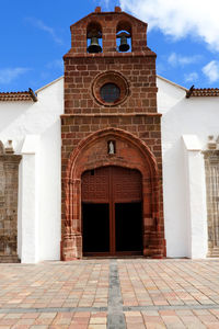 Church of the assumption against blue sky at la gomera