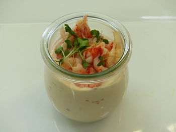 High angle view of crab salad served in jar on table