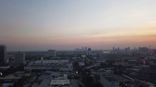 High angle view of buildings against sky during sunset