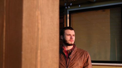 Portrait of young man looking away